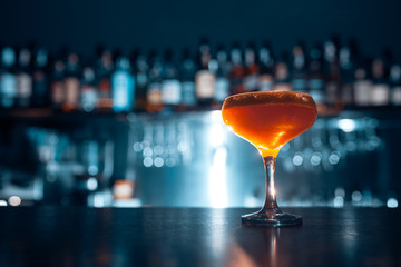 orange cocktail on blue background;