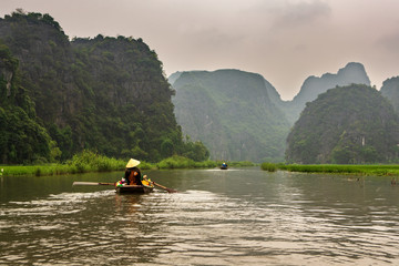 Touristic boat ride in Hao Lu in Ninh Binh city, Vietnam.It is a famous national park with its rivers and the caves.