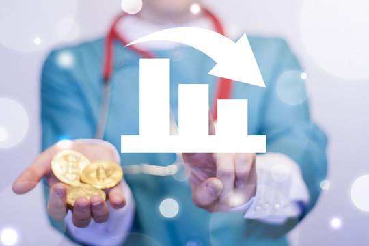 Doctor clicks a chart fall button and offers a gold coins. Financial Graph Downfall Crisis Collapse Failure Bankruptcy Medicine concept. Diagam Decline Healthcare Bitcoin.