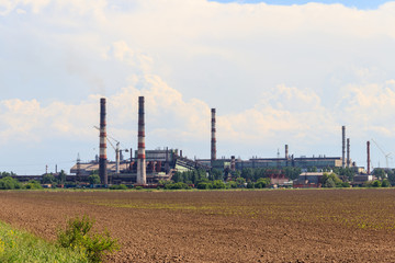 Fototapeta na wymiar Industrial landscape. View of factory in Nikopol, Dnepropetrovsk region, Ukraine