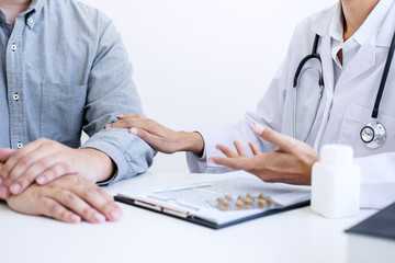 Doctor consulting patient and recommend treatment methods and how to rehabilitate the body and use medicine