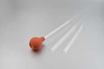 Glass Pasteur Pipettes stock images. Laboratory accessories images. Pipette on a silver background....