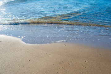 Beautiful waves on the beach from the ocean or the sea