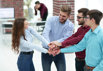 Group of people hands together partnership teamwork.