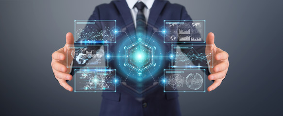 Businessman using digital screens interface with holograms datas 3D rendering