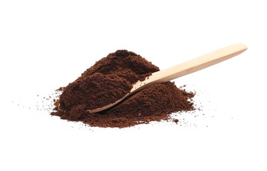 Pile of powdered, instant coffee with wooden spoon isolated on white background