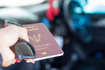 Passports and glasses on a background of car