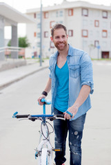 Cool guy with a vintage bicycle in the city