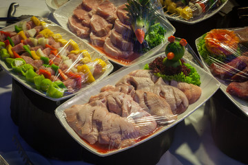 Raw meat in plastic wraps