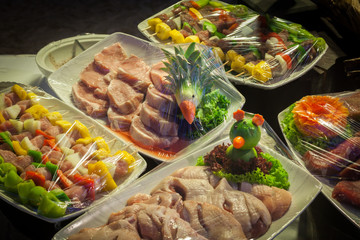 Raw meat in plastic wraps