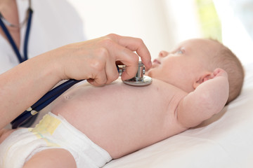 Baby examination with stethoscope