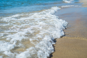 Waves of the ocean or sea on the beach
