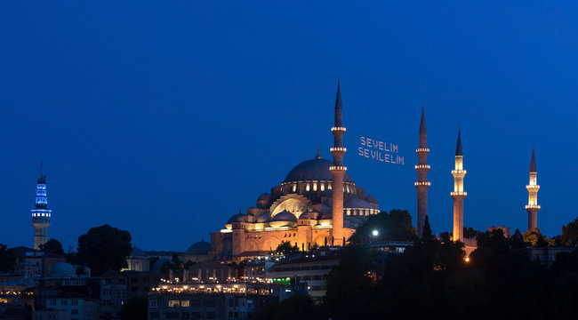"Let's Love Love" lettering hanging on Suleymaniye Mosque mahya in Istanbul,Turkey