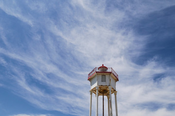 Low angle view of maritime lighthouse at Port Vendres with amazing cloudy blue sky, South of France