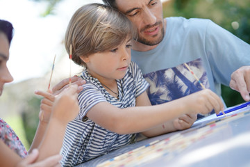 Happy family enjoying playing game together