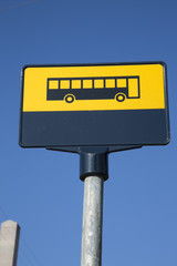 Yellow Bus Sign against Blue Sky