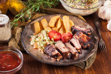 Spicy barbecued pork ribs with french fries