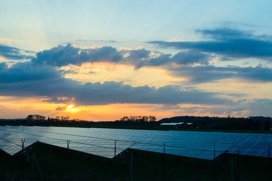 Solar panel at sunset background. Alternative electricity