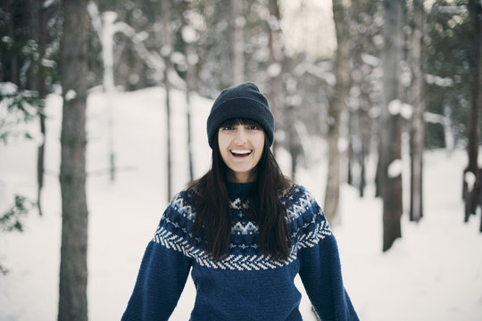 Portrait of young woman in snowy forest