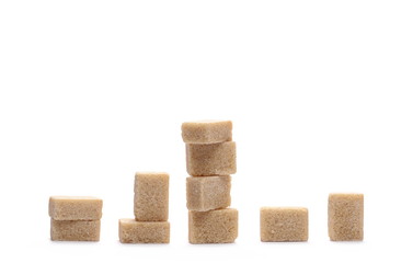 Brown cane sugar cubes isolated on white background