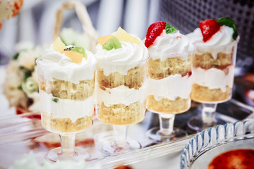 Mini cakes with fresh berries and vanilla cream