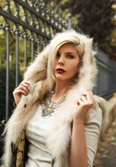 Young blonde woman wearing fur