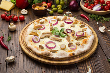 Pizza with mushrooms, mozzarella cheese and onion on wooden background