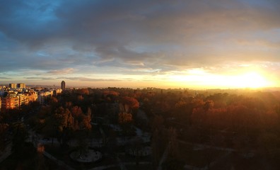 Panoramic aerial sunset over Retiro Parc, Madrid