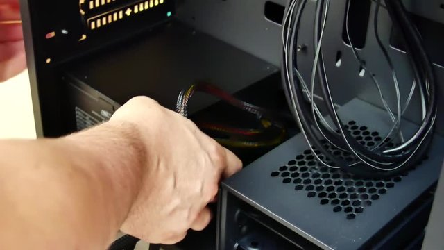 Installation power supply computer in the computer's system unit or case. Concept of computer hardware, repairing, upgrade and technology