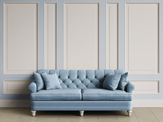 Tufted ivory color sofa in classic interior with copy space
