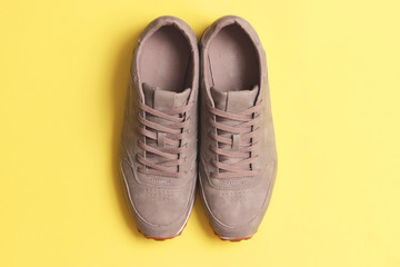 men's sneakers on a colored background top view. men's footwear. minimalism