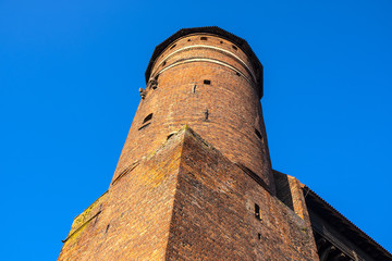 Olsztyn, Poland - Defense tower in Castle of Warmian Bishops in historical quarter of Olsztyn old town
