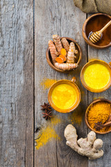 Traditional indian drink turmeric curcuma golden milk with ingredients