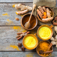 Traditional indian drink turmeric curcuma golden milk with ingredients