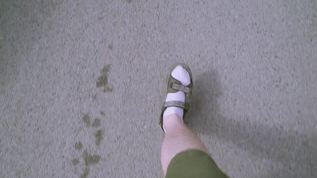 18240_A_man_walking_on_the_concrete_road_in_the_city.mp4