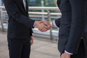 young successful businessman,Businessmen are shaking hands