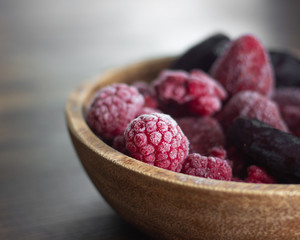 frozen berries in a wooden cup