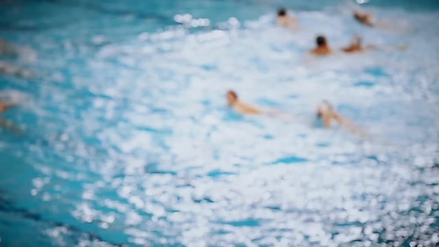 Unfocused video of a water polo match 