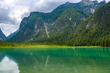 Fototapeta na wymiar Lake Dobbiaco (Toblacher See, Lago di Dobbiaco) in Dolomite Alps, South Tirol, Italy - Travel destination in Europe