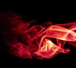 Red smoke on black background