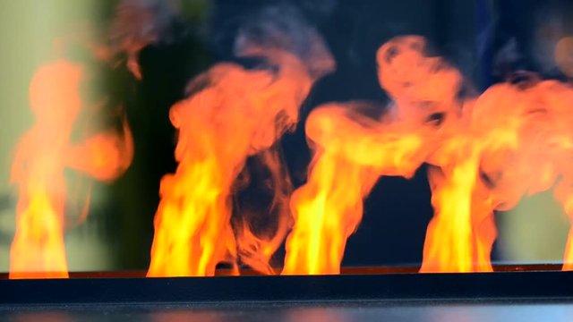 Electric fireplaces with built-in evaporator converts water into steam, which simulates smoke close-up. Model with 3D effect. Modern smart ecological alternative technologies. Energy saving innovation