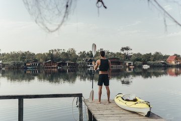 Kayaker Looking at River
