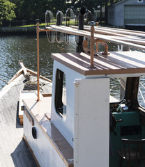 Fototapeta na wymiar Clamboat moored in a long island canal
