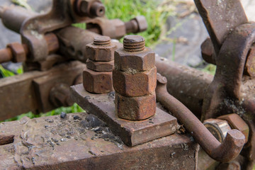 Rusty metal construction with bolts and nuts