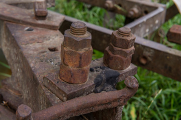 Rusty metal construction with bolts and nuts