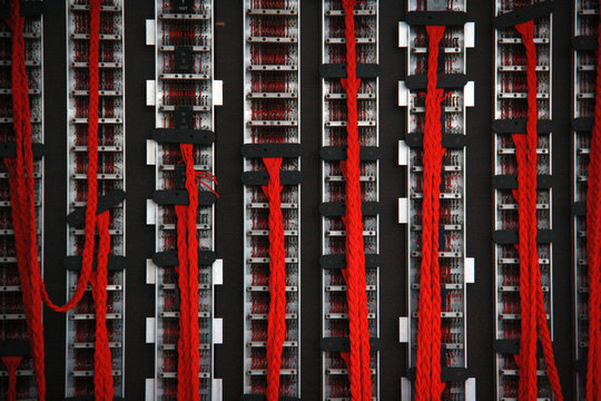 Close up of red wires on the back of the British military's Bombe machine, used to decode German Enigma machine encoded messages during world war 2