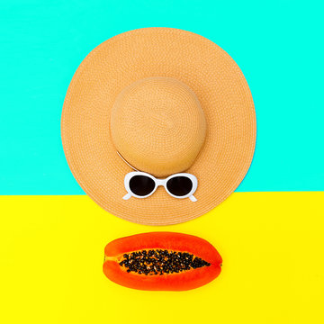 Straw hat and sunglasses. Minimal beach outfit