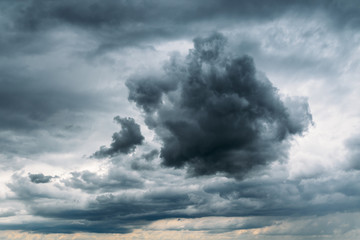 Fototapeta na wymiar Dark Storm Clouds Gathering On Sky Before Rain Background