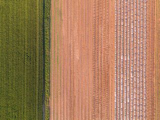 Agricultural landscape, aerial shot of an arable crop field. Arable land is the land under temporary agricultural crops capable of being ploughed and used to grow crops.
