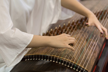 Playing the zither's moment